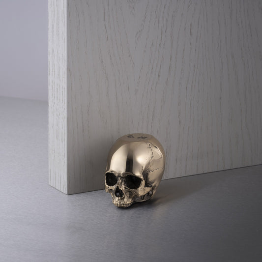 SKULL DOOR STOP / TRAVIS BARKER / BRASS