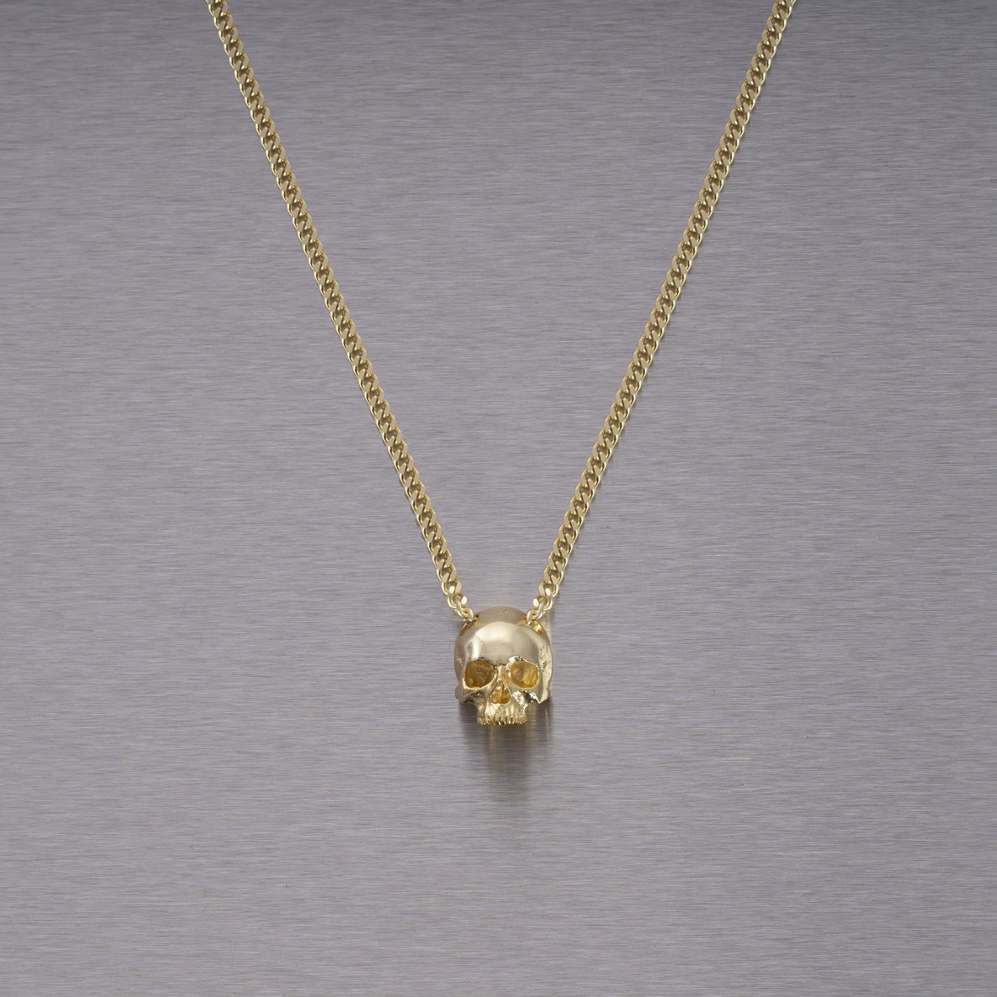 SKULL NECKLACE / TRAVIS BARKER / GOLD